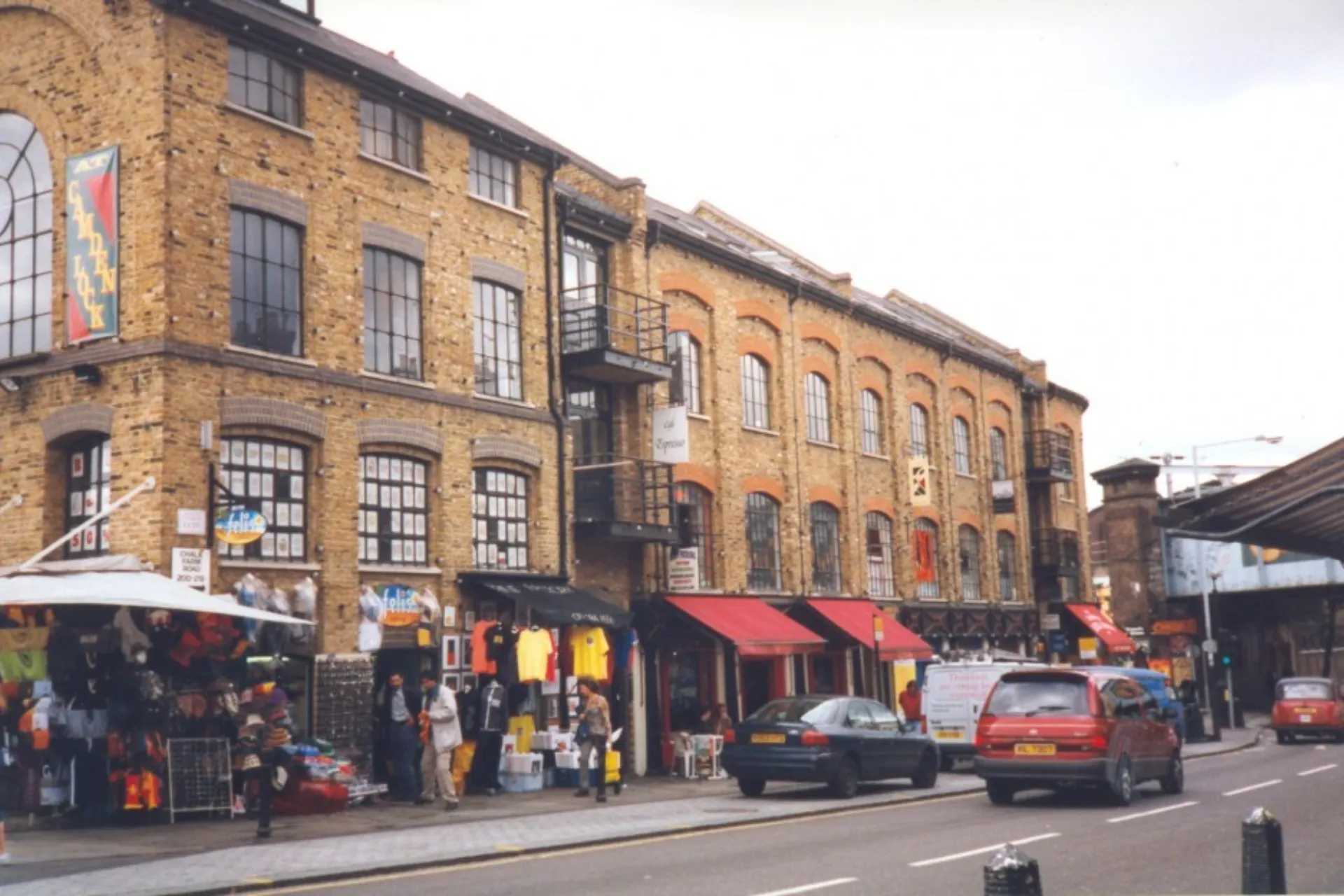 152 Camden High Street exterior view: a four story brick warehouse building with shops at ground level