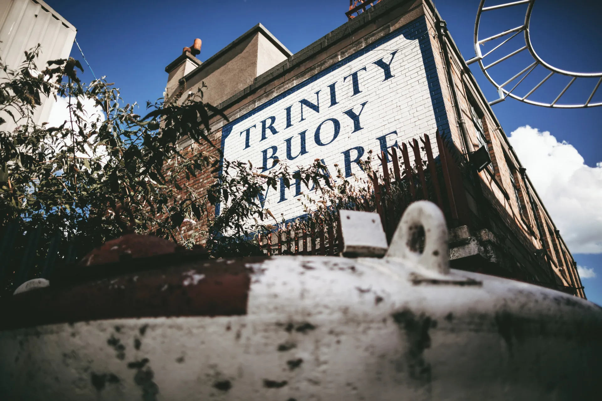Building with painted Trinity Buoy Wharf sign