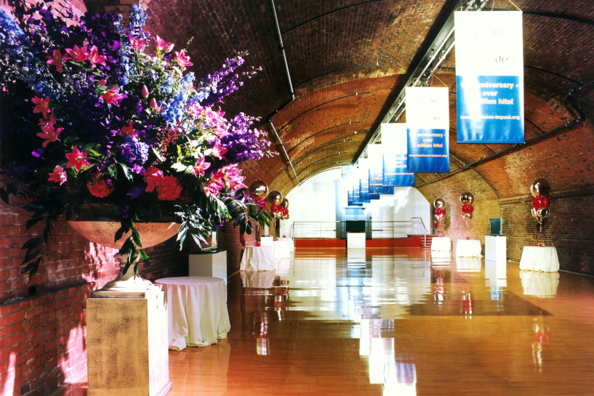 Flower stand in the arches with exposed brick