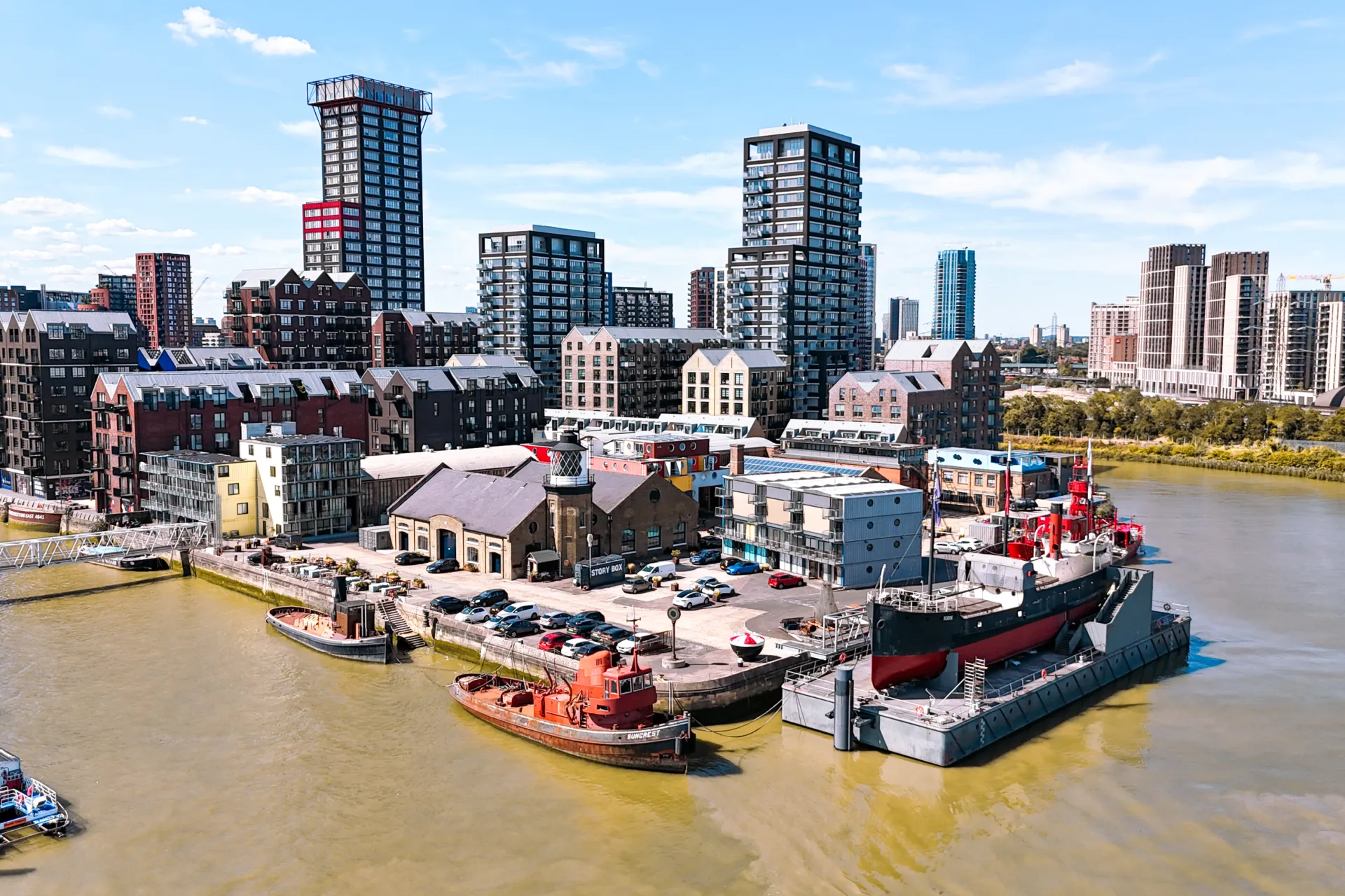 Aerial view of buildings surrounded by river